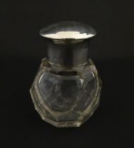 A cut glass scent / perfume bottle with silver top hallmarked Chester 1912. Approx. 2 3/4" high