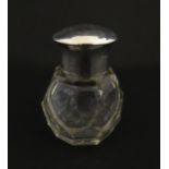 A cut glass scent / perfume bottle with silver top hallmarked Chester 1912. Approx. 2 3/4" high