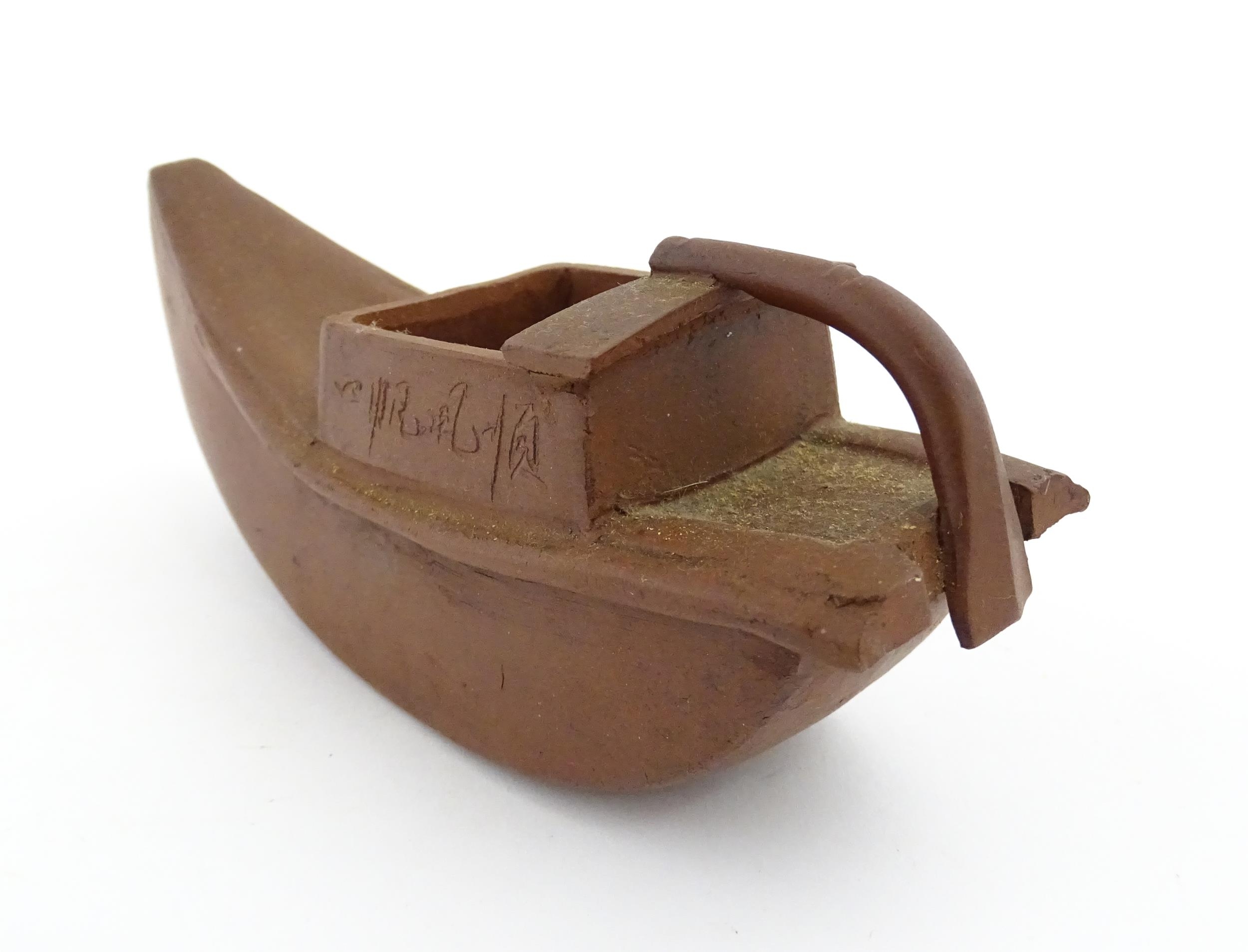 A Chinese Yixing teapot modelled as a boat with incised Character marks and Character seal under. - Image 5 of 8