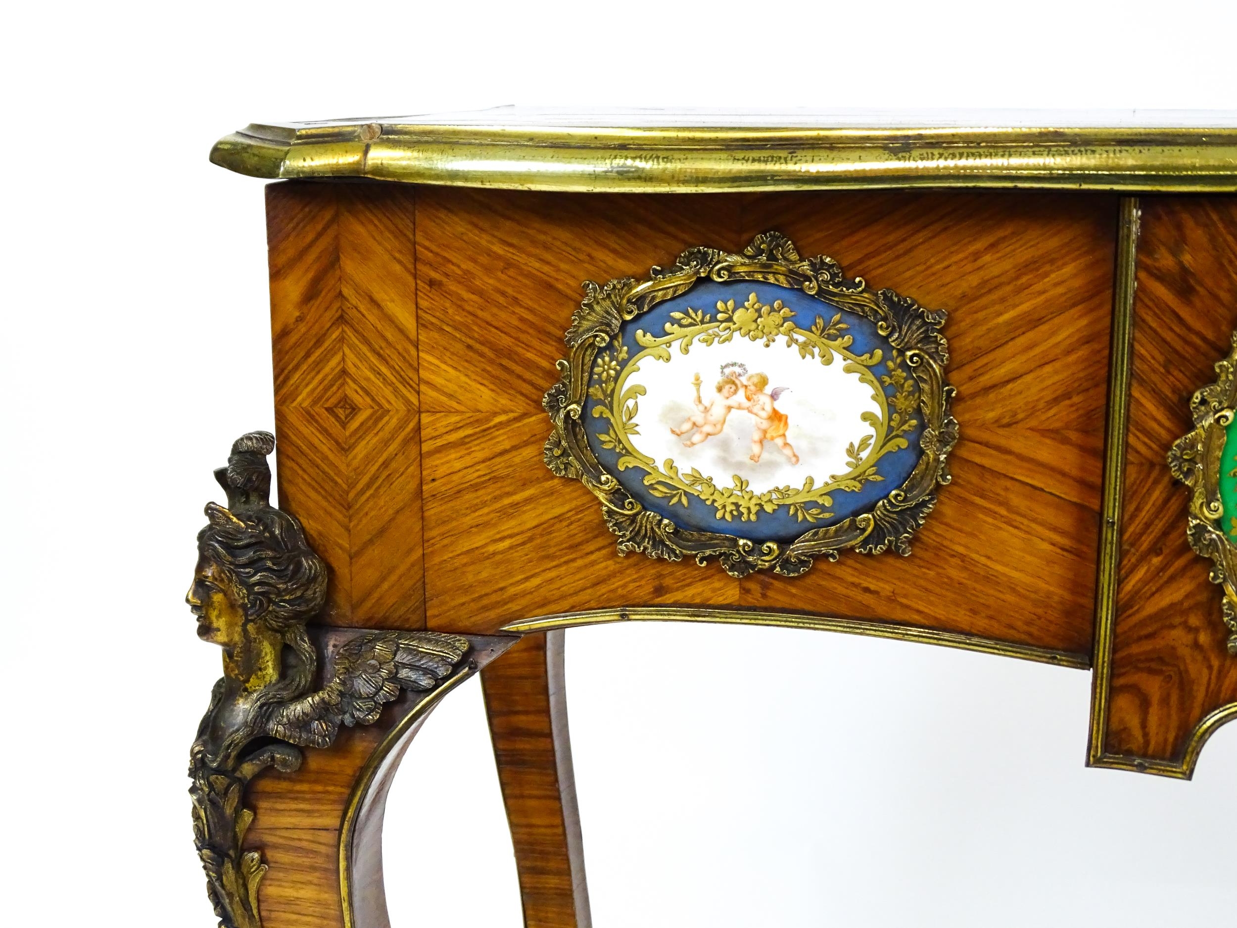 A mid 19thC kingwood side table with a brass moulding to the top edge and three Sevres style plaques - Image 11 of 14