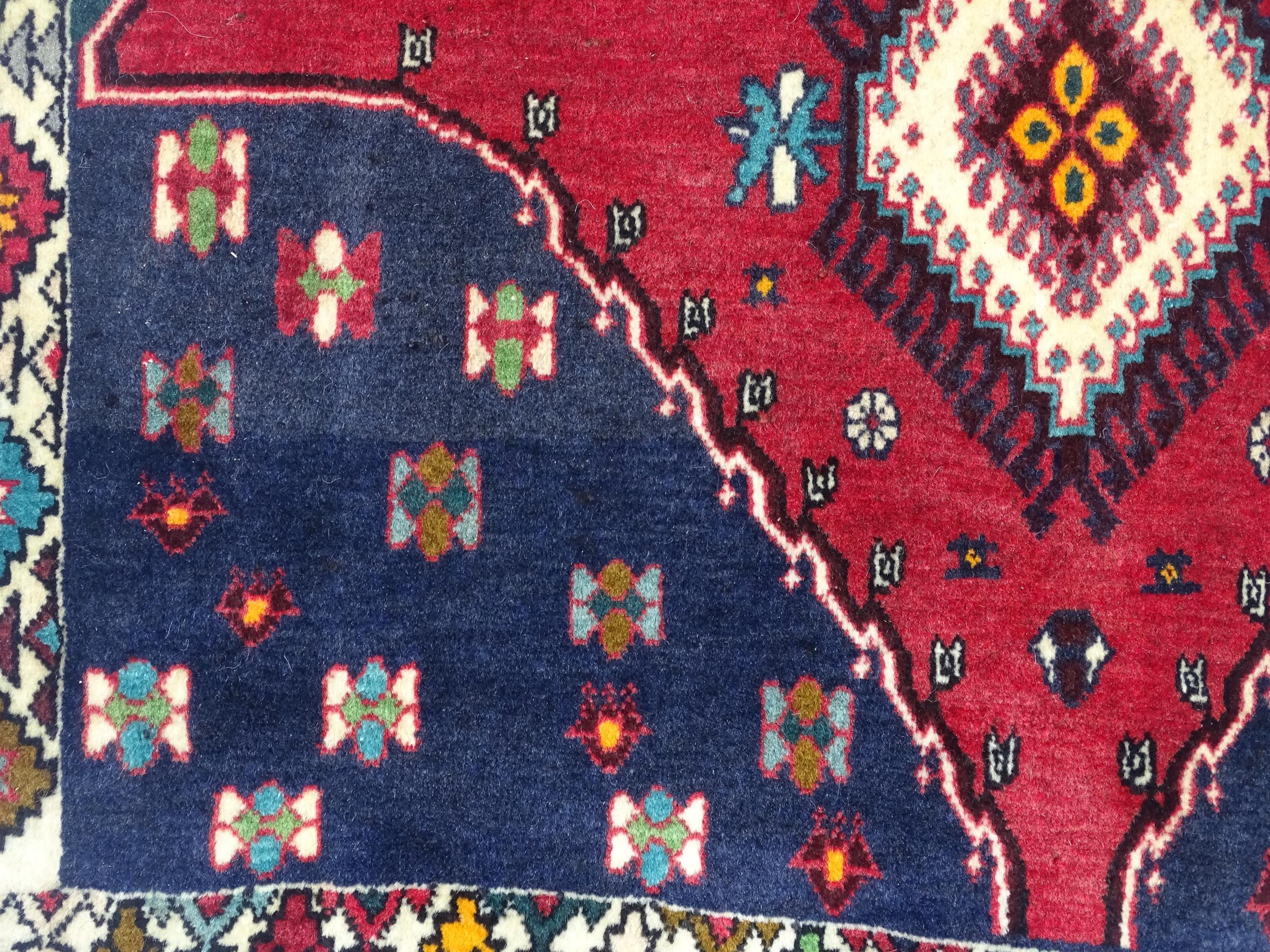 Carpet / Rug: A South West Persian Qashqai rug the red ground decorated with geometric motifs. - Image 9 of 9