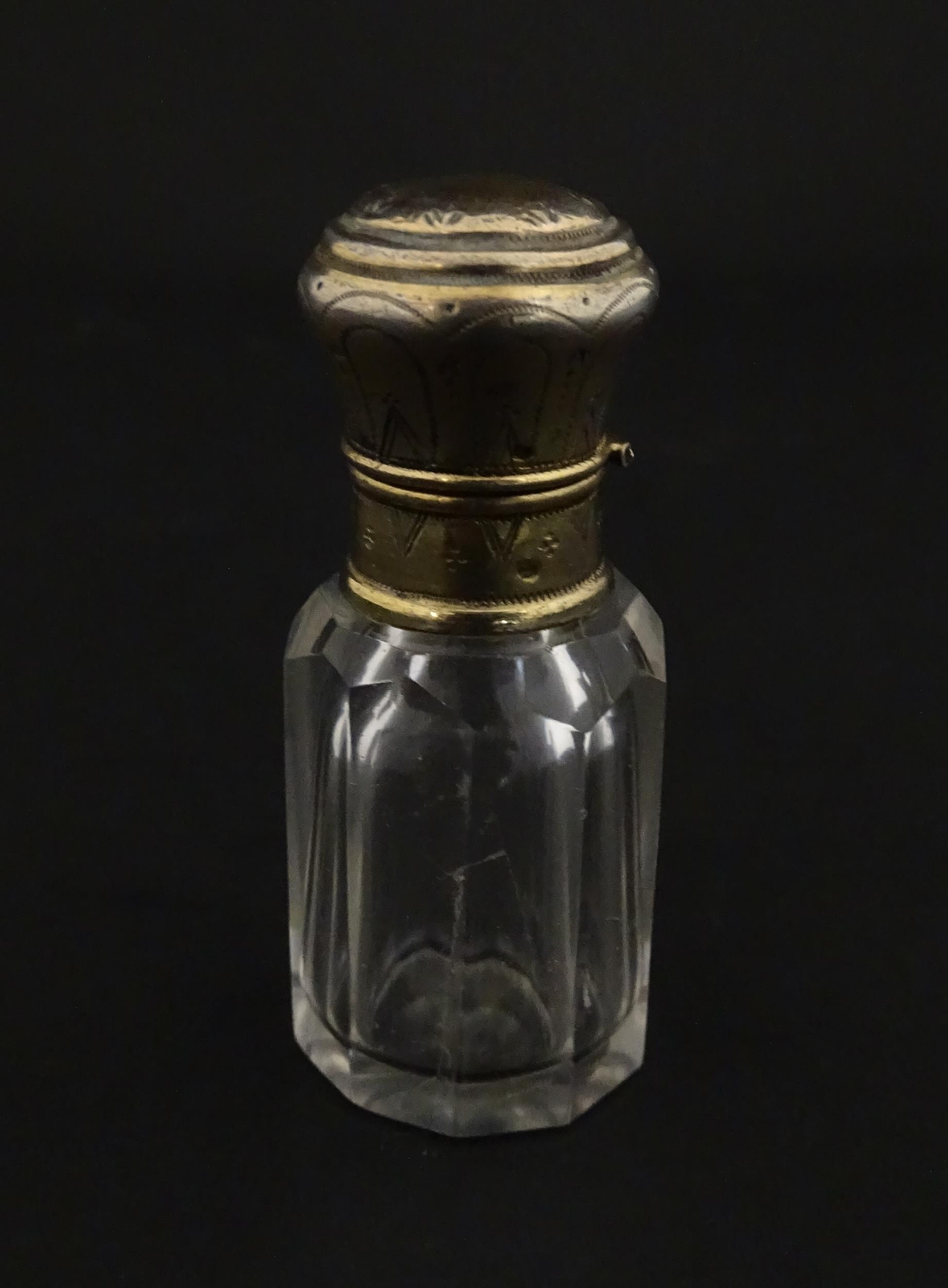 A French scent / perfume bottle with silver gilt top. Approx. 2 1/4" high Please Note - we do not - Image 7 of 10