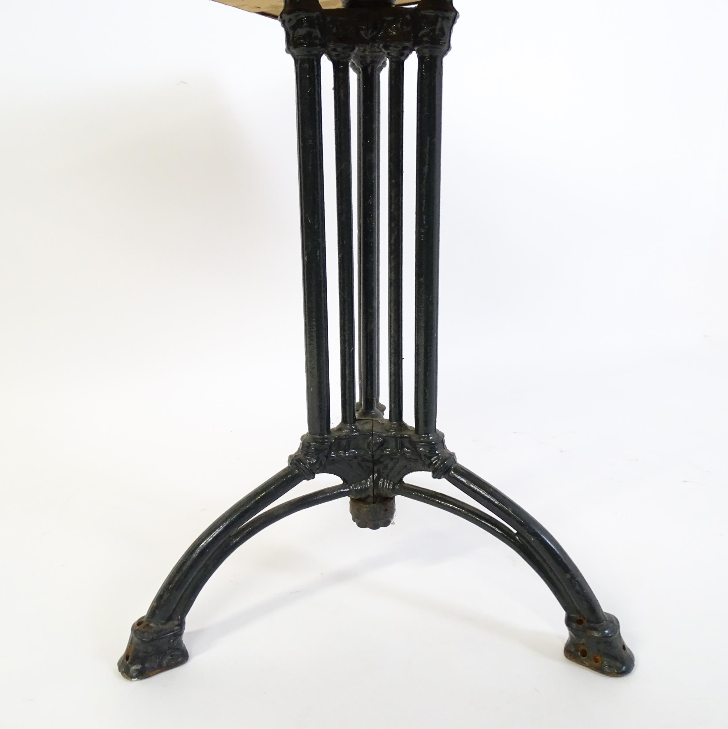 An early 20thC cast iron based pub / cafe / bistro table, with squared advertising top marked - Image 8 of 12