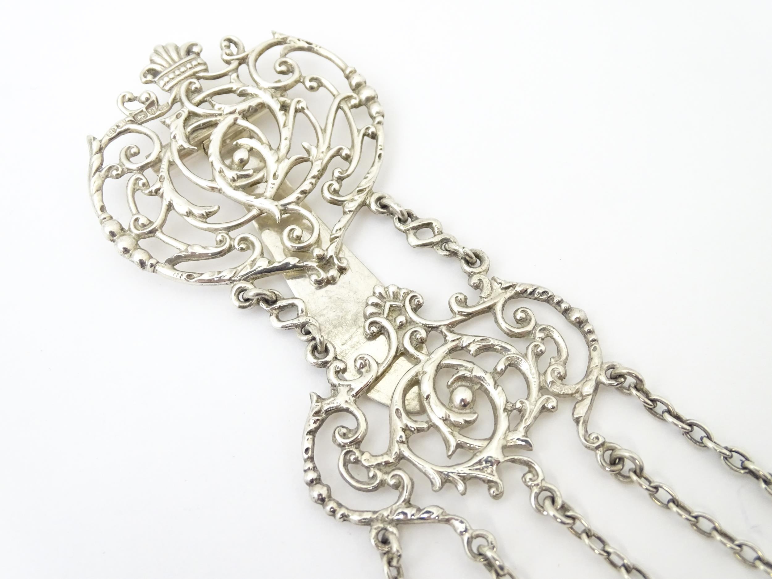 A silver chatelaine with openwork scrolling detail and having five chains, hallmarked Chester - Image 3 of 19