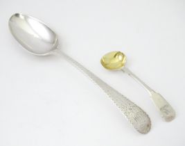 A silver table spoon with bright cut decoration hallmarked London 1784. Together with a silver