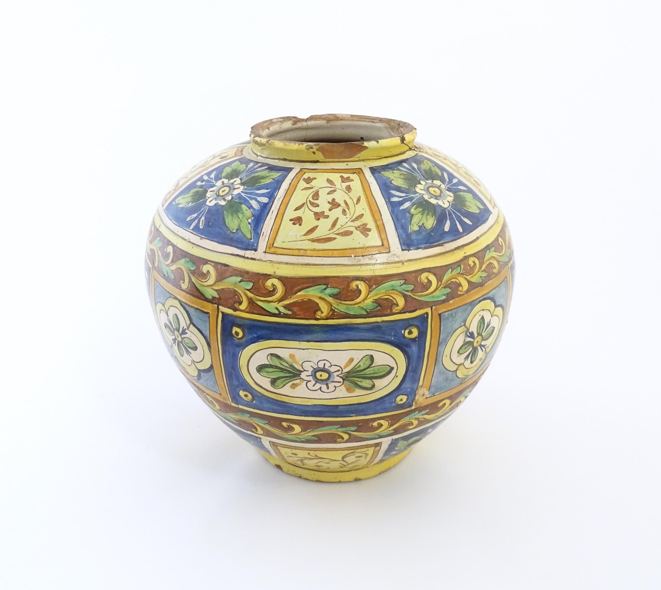 A Sicilian maiolica Bombola vase with panelled and banded decoration depicting flowers and - Image 4 of 10