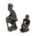 Ethnographic / Native / Tribal : An African soapstone carving modelled as a tribesman playing a