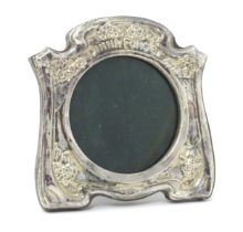 An easel back photograph frame with embossed silver surround titled 'Dinna Forget', hallmarked