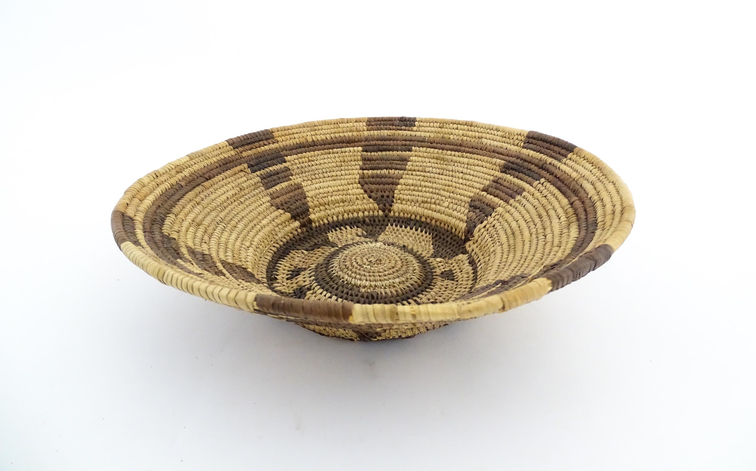 Ethnographic / Native / Tribal: A woven basket bowl with geometric banded detail, possibly Native