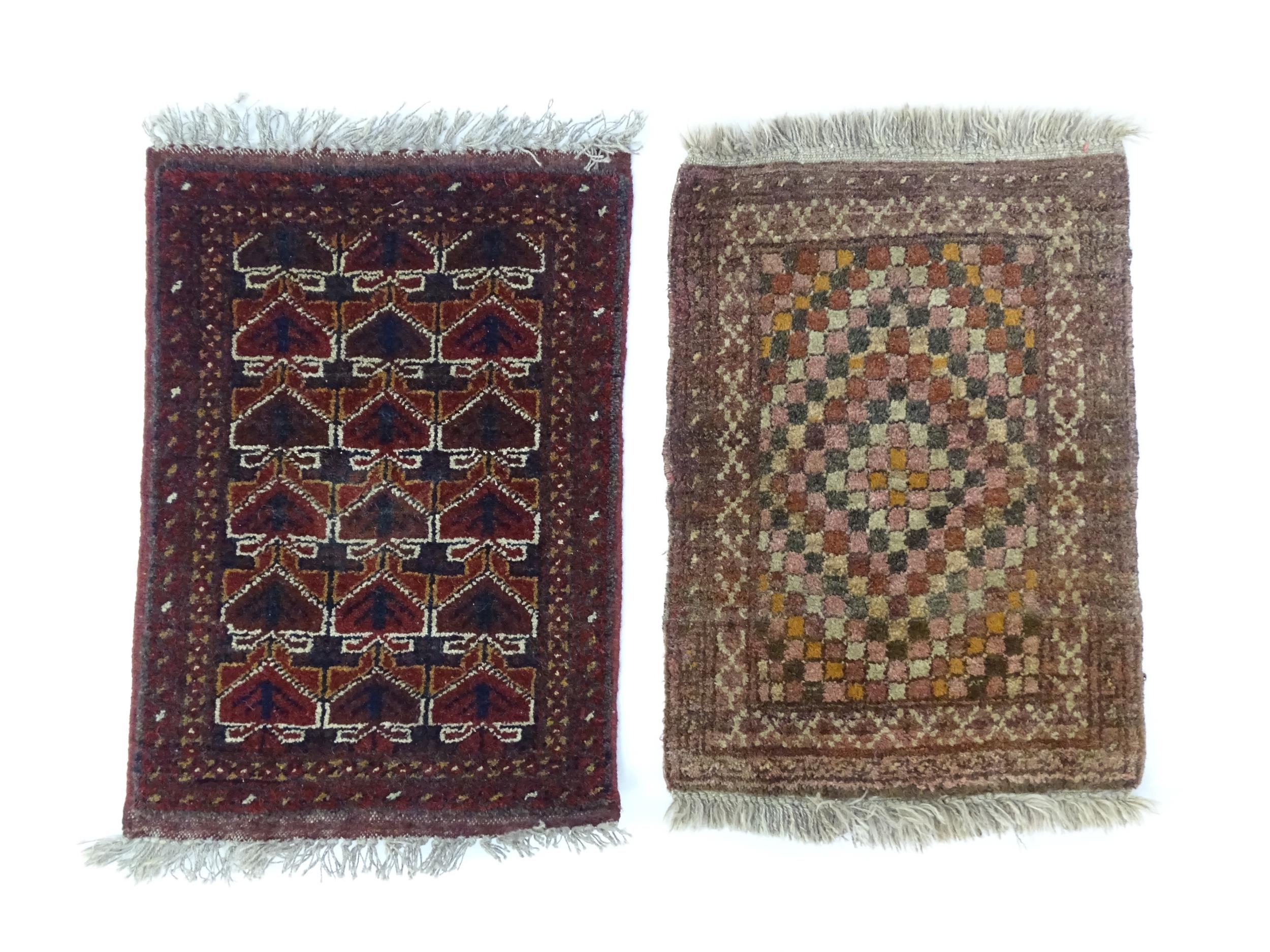 Carpets / Rugs: Two small rugs, one with burgundy ground with repeating motifs, the other with