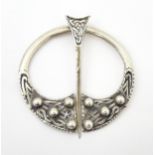 A Scottish silver penannular brooch / pin with Celtic decoration. Hallmarked Glasgow 1941 maker