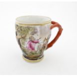 A Continental coffee cup decorated in relief with animals in a landscape. Marked under with