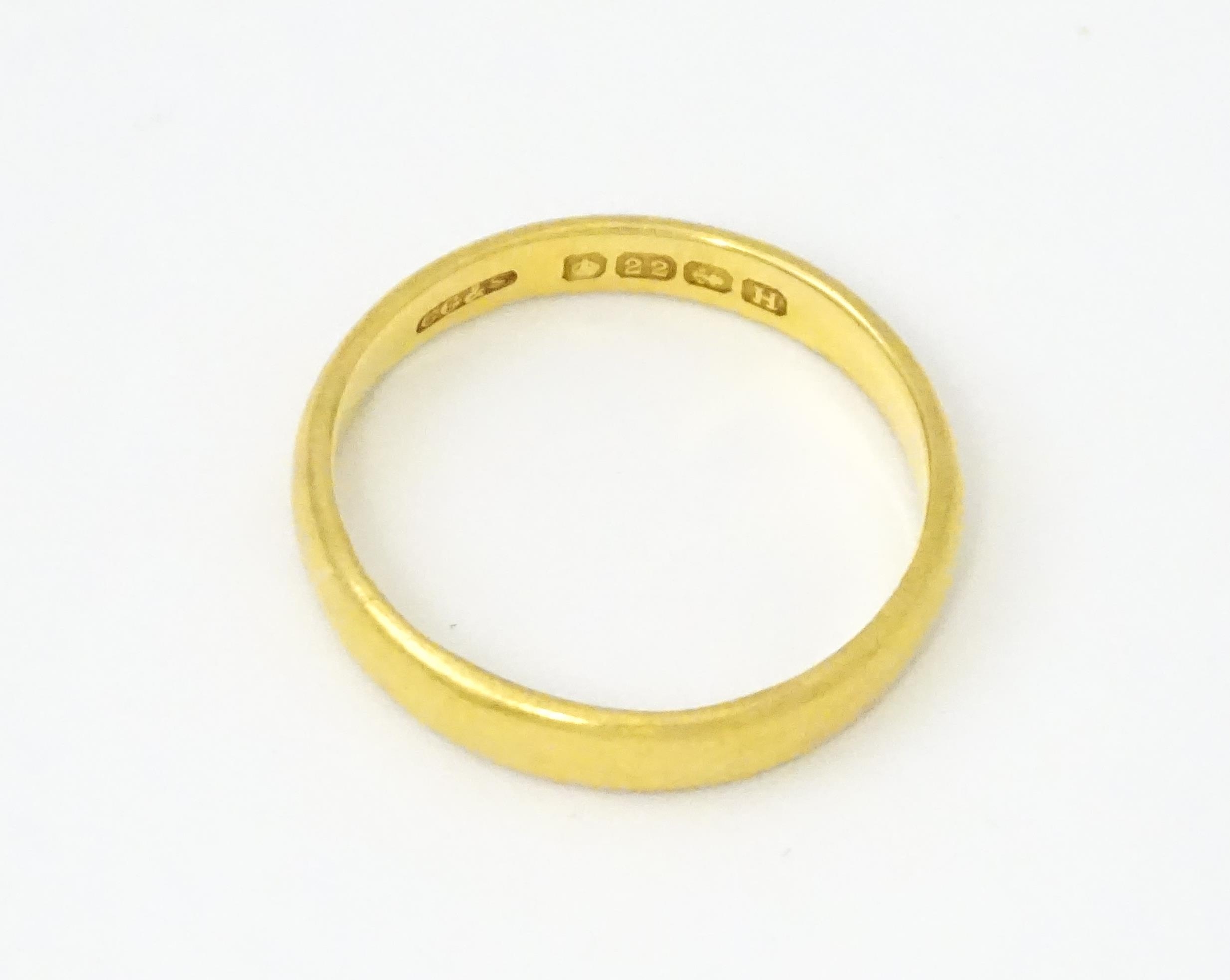 A 22ct gold ring / wedding band. Ring size approx. L 1/2 Please Note - we do not make reference to - Image 3 of 6