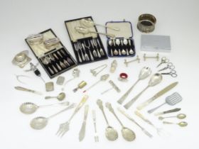 A quantity of silver plated items to include servers, assorted flatware, coaster, bottle stoppers,
