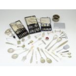 A quantity of silver plated items to include servers, assorted flatware, coaster, bottle stoppers,