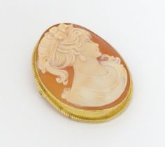 A shell carved cameo brooch within a 9ct gold mount, Birmingham 1989, maker Rolason Brothers.