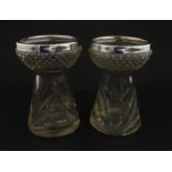 A pair of cut glass vases with silver rims in the style of hyacinth vases, hallmarked Birmingham