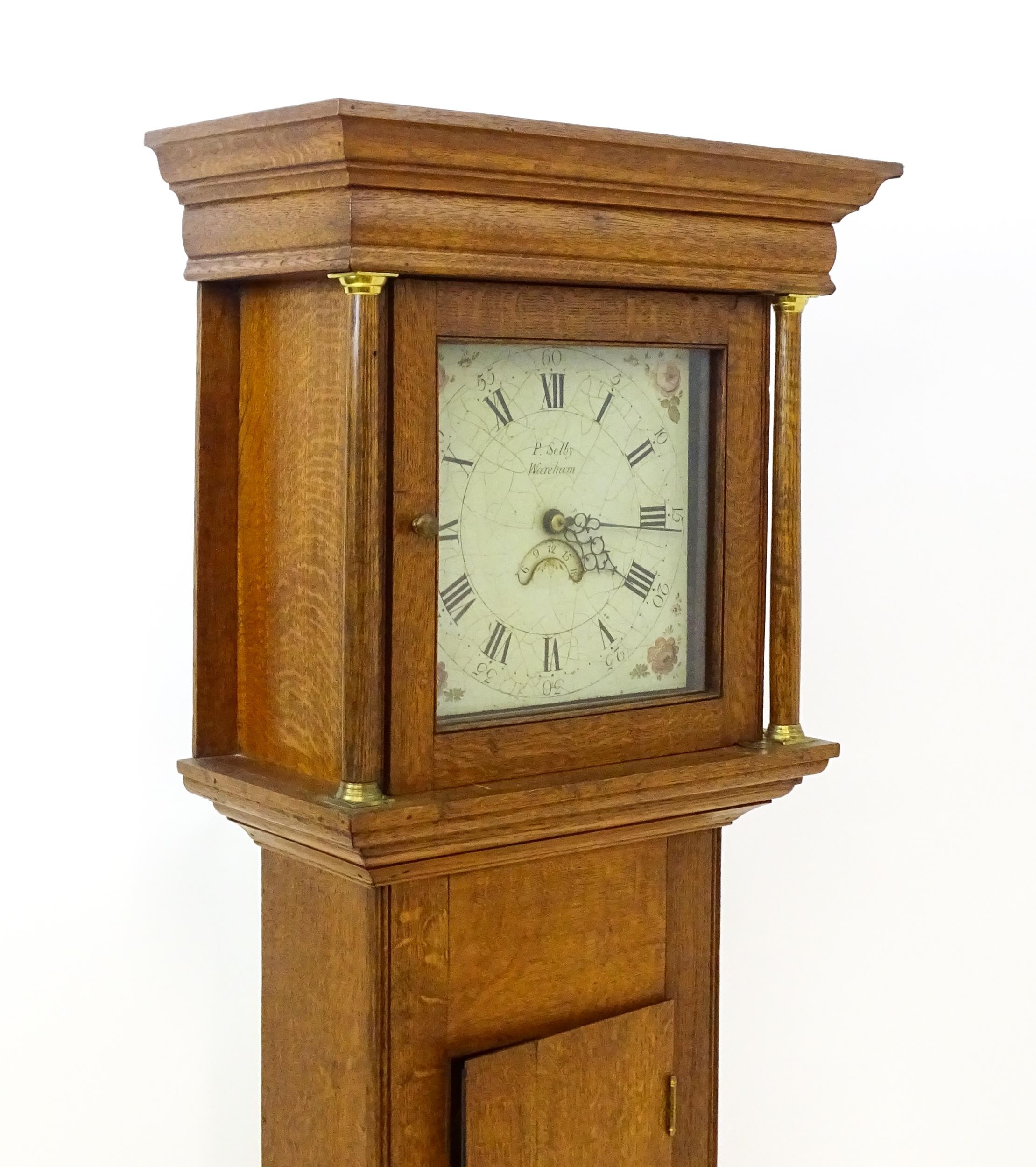 P Selby Wareham - Dorset : A late 18thC oak cased 30 hour longcase clock, the painted dial signed P. - Image 12 of 12