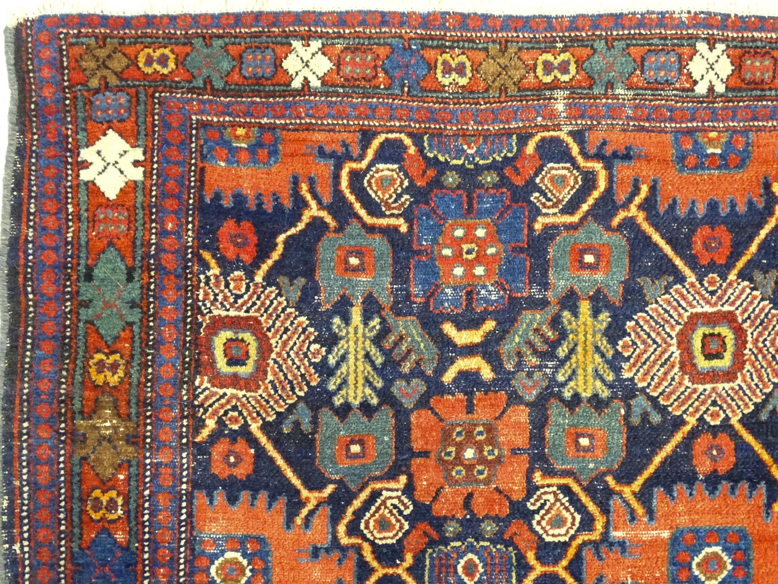 Carpet / Rug: A blue ground rug decorated with repeating geometric motifs of stylised floral and - Image 3 of 8