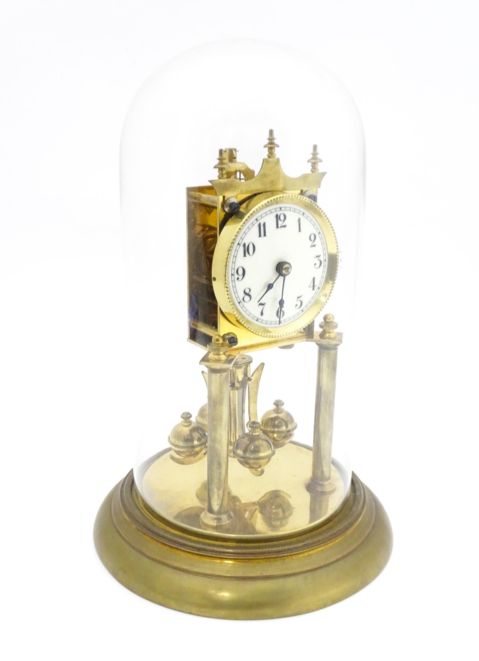 A 20thC anniversary / table clock with white enamel dial and Roman numerals. Under glass dome - Image 12 of 12