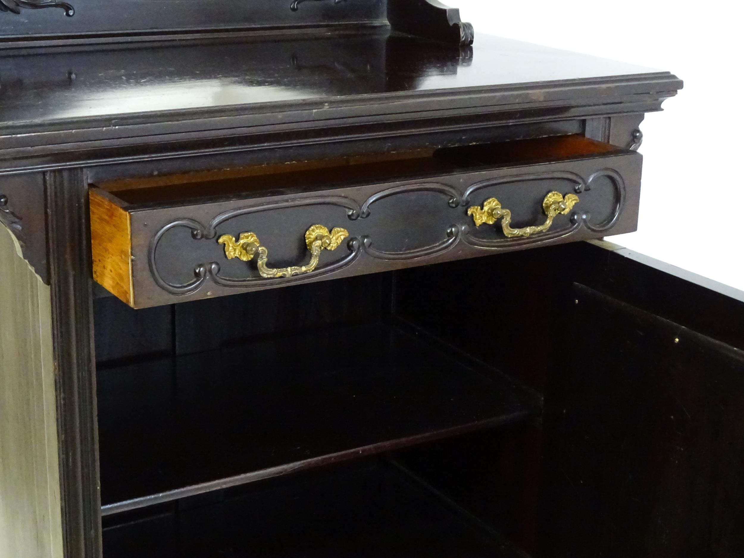 A late Victorian ebonised side cabinet with a mirrored upstand, a moulded top and a single frieze - Image 5 of 6