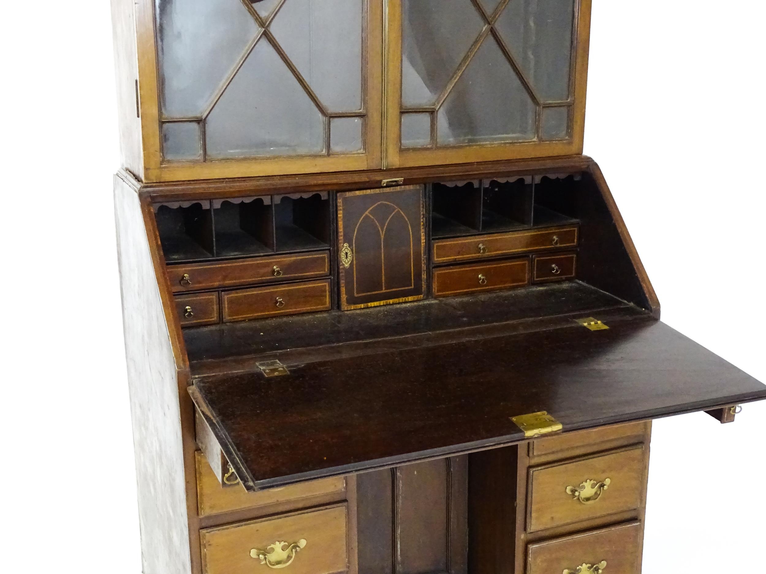 A Georgian mahogany bureau bookcase, with a moulded top above two astragal glazed doors and a fall - Image 8 of 11