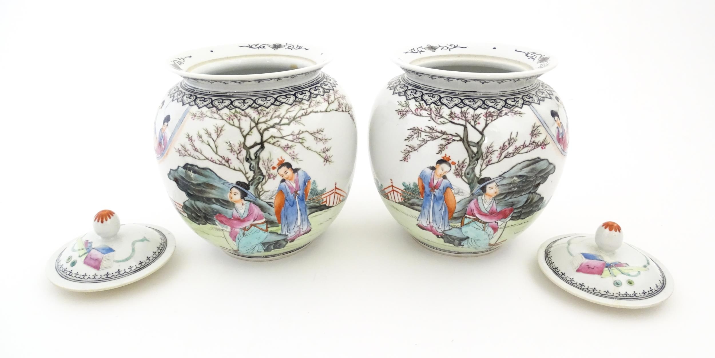 A pair of Chinese pot and cover vases decorated with ladies in a landscapes, and Character script. - Image 4 of 10