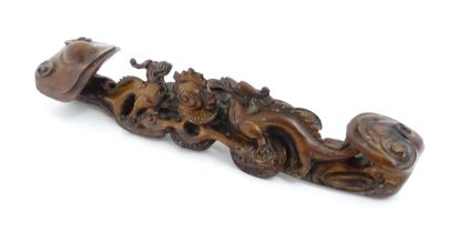 A Chinese carved hardwood ruyi sceptre with dragons and flaming pearl decoration. Approx. 16 3/4"