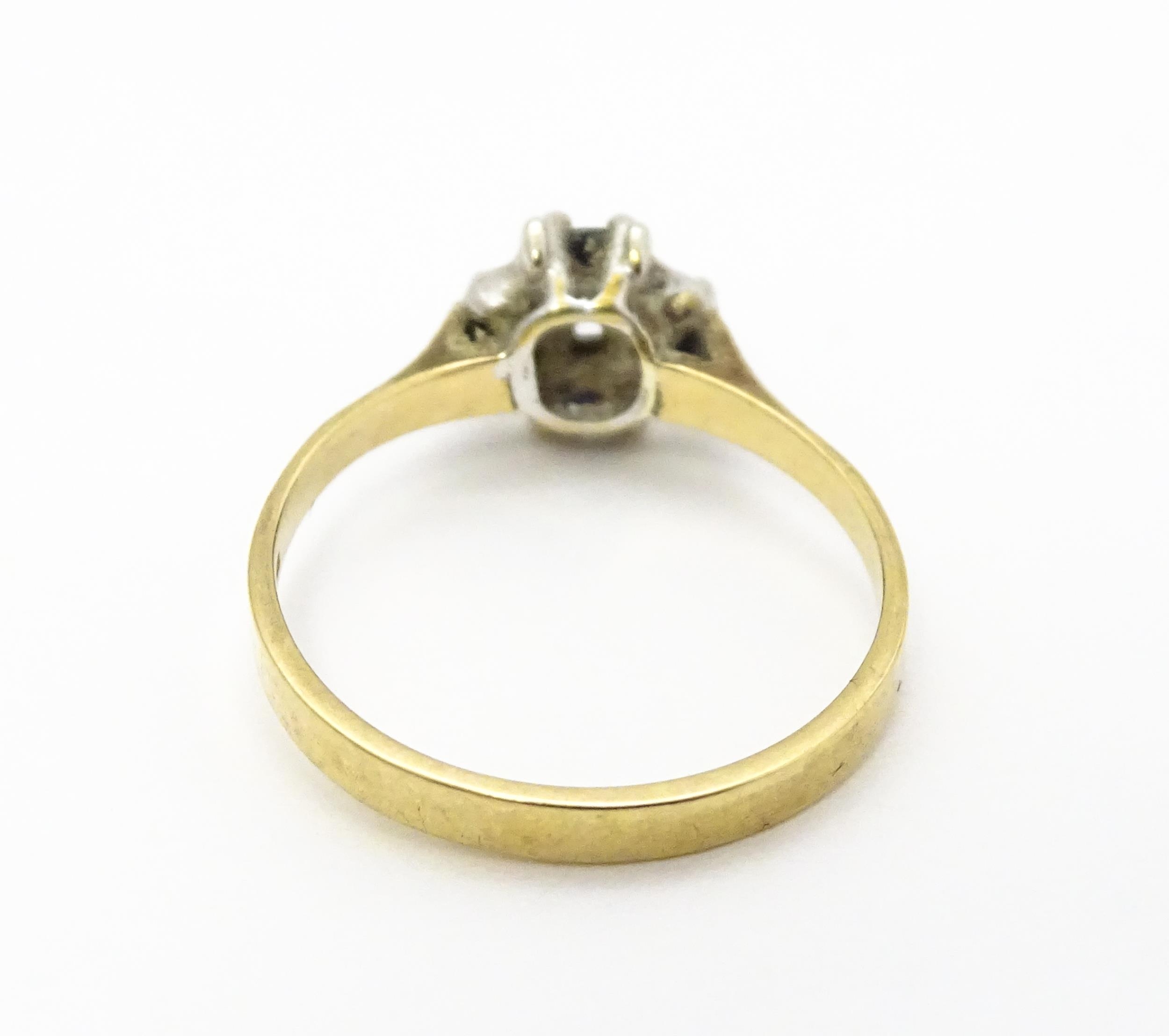 A 9ct gold ring set with diamonds and blue stones. Ring size approx. L Please Note - we do not - Image 5 of 7