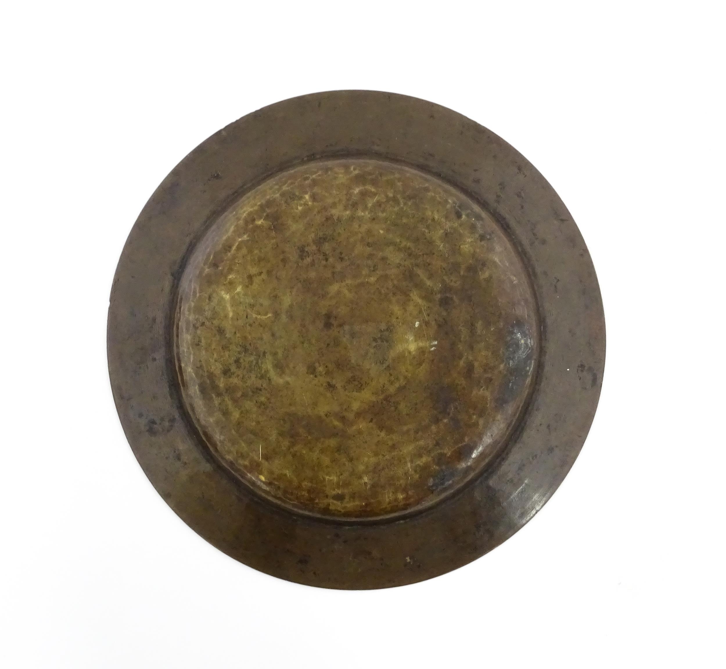 A Middle Eastern brass dish with script and banded detail. Approx. 9 1/2" diameter Please Note - - Image 2 of 3