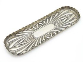 A Victorian silver pen dish / tray with embossed decoration hallmarked London 1897, maker William