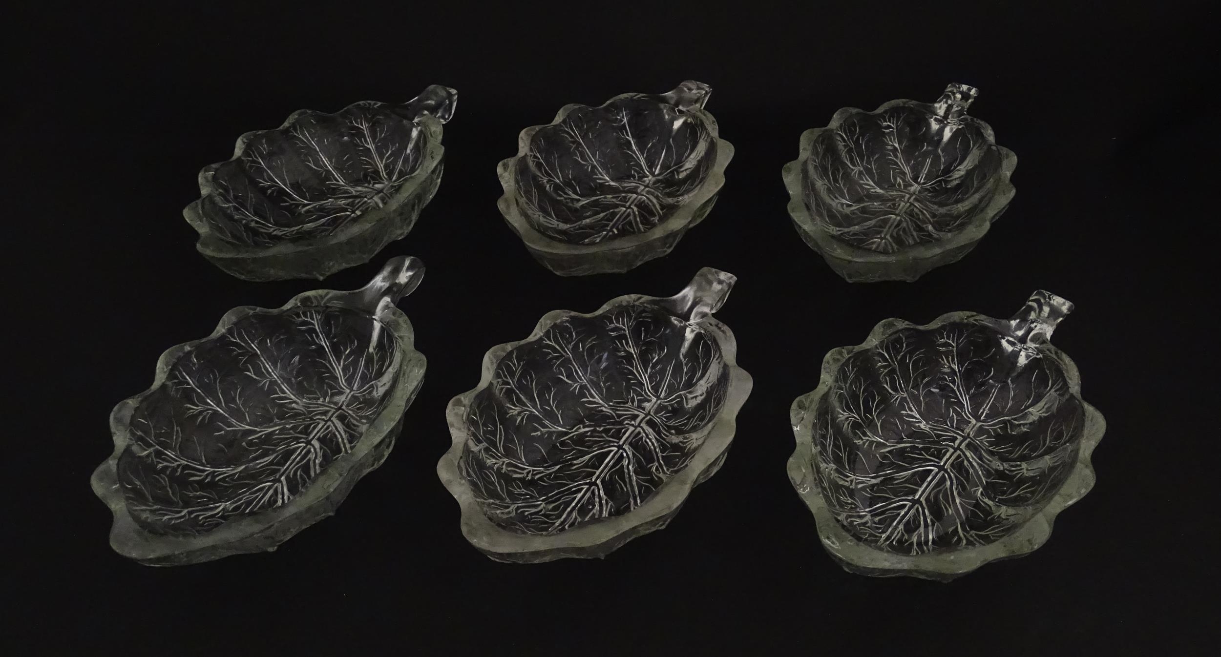 A set of six glass avocado dishes of stylised leaf form. Approx. 7" long Please Note - we do not