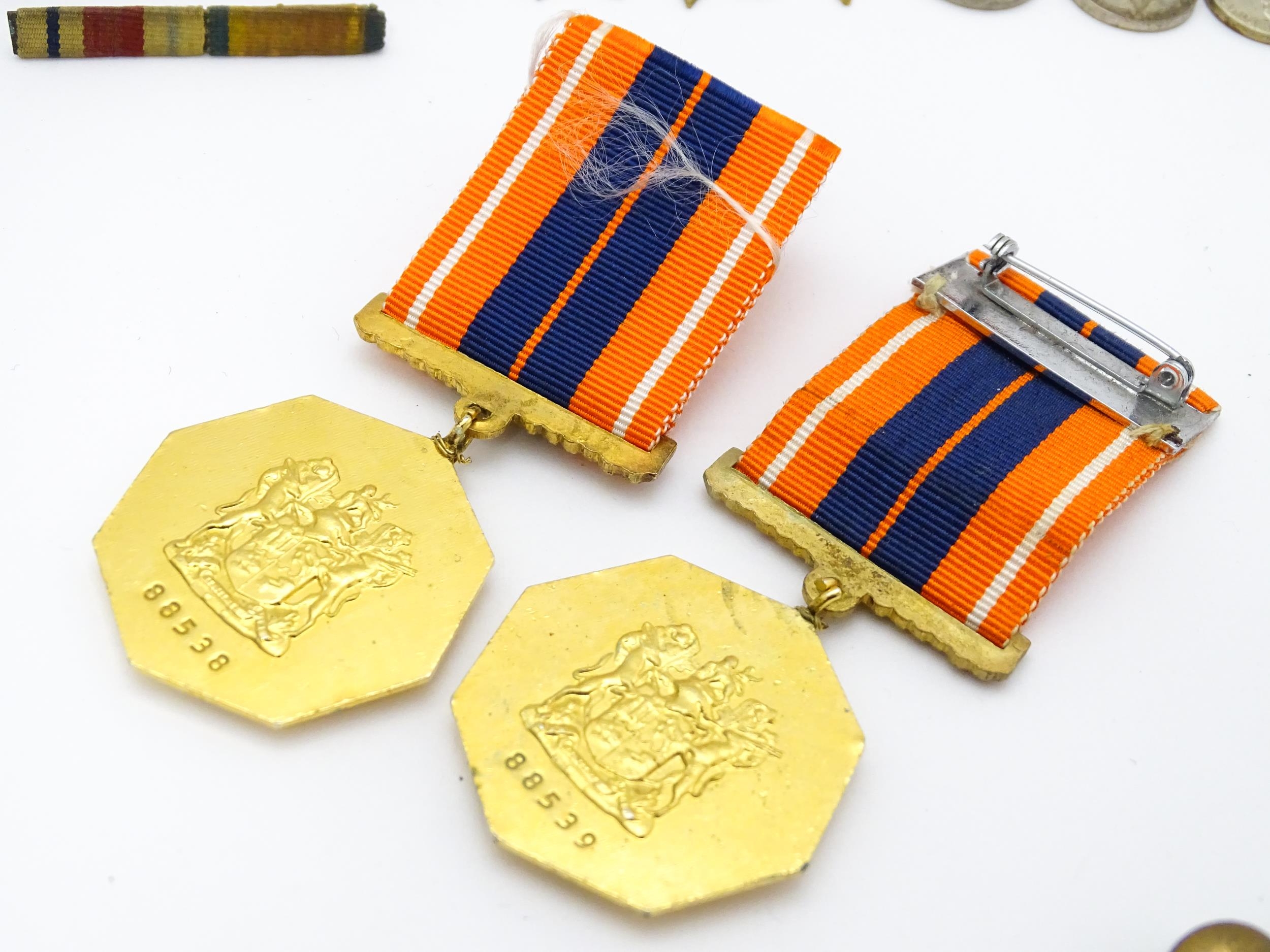 Militaria : a quantity of 20thC medals and insignia, comprising two WWI campaign medals to Gnr. W. - Image 15 of 16