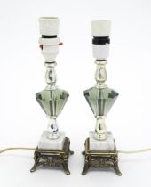 A matched pair of facet cut glass table lamps with marble detail to base. Approx. 11 1/4" high (2)