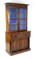 A 19thC mahogany secretaire bookcase with a moulded top above to glazed doors and three adjustable