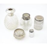 Five assorted glass bottles / jars with silver mounts / tops including a glass salt with silver