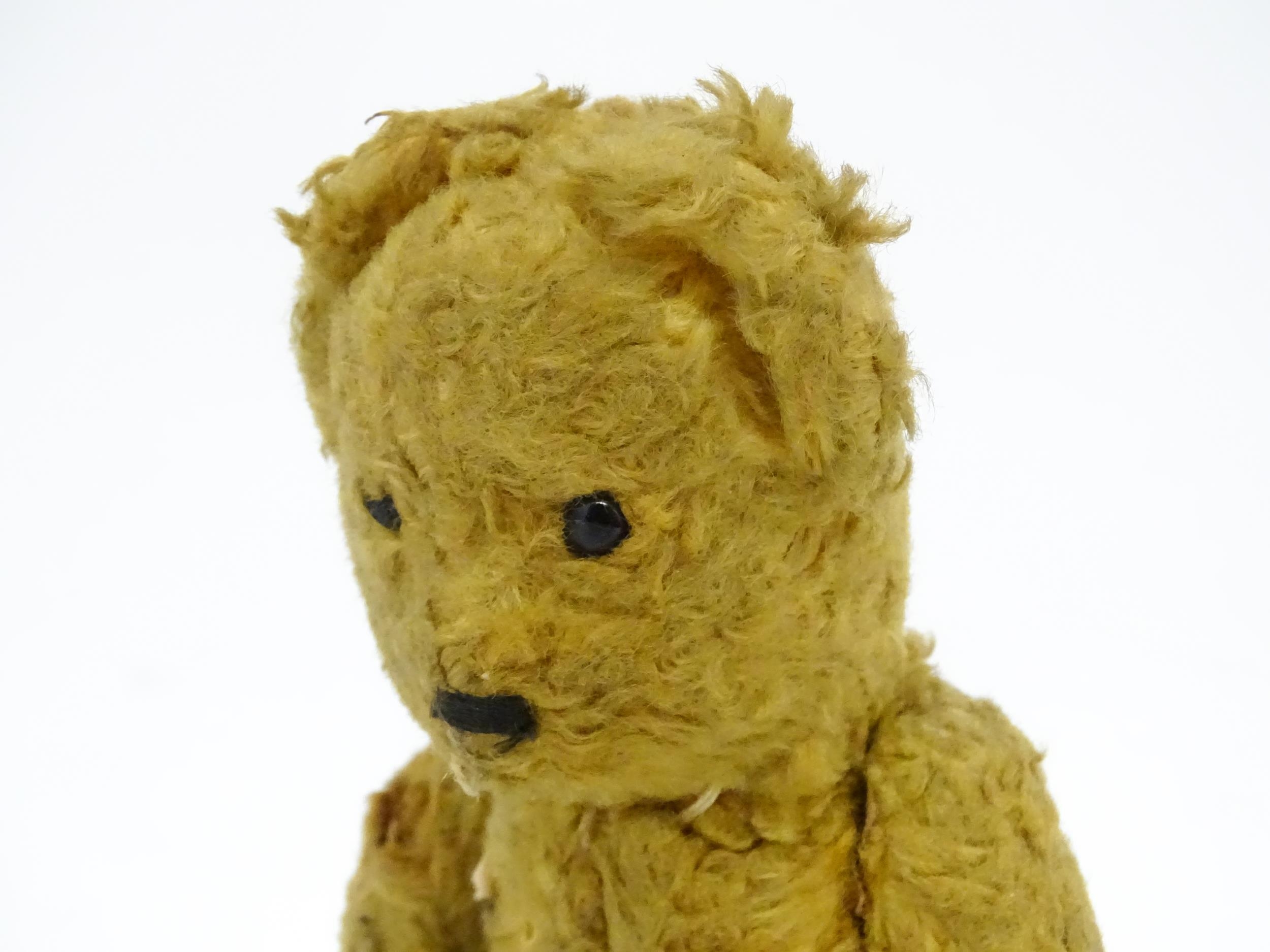 Toy: An early 20thC straw filled teddy bear with stitched nose and articulated limbs. Approx. 7" - Image 4 of 7