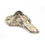 A 20thC cast paperweight modelled as a the head of a Greyhound / Whippet dog. Approx. 4" long Please