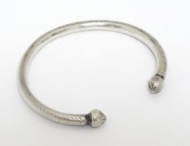 A white metal torque bangle / bracelet Please Note - we do not make reference to the condition of