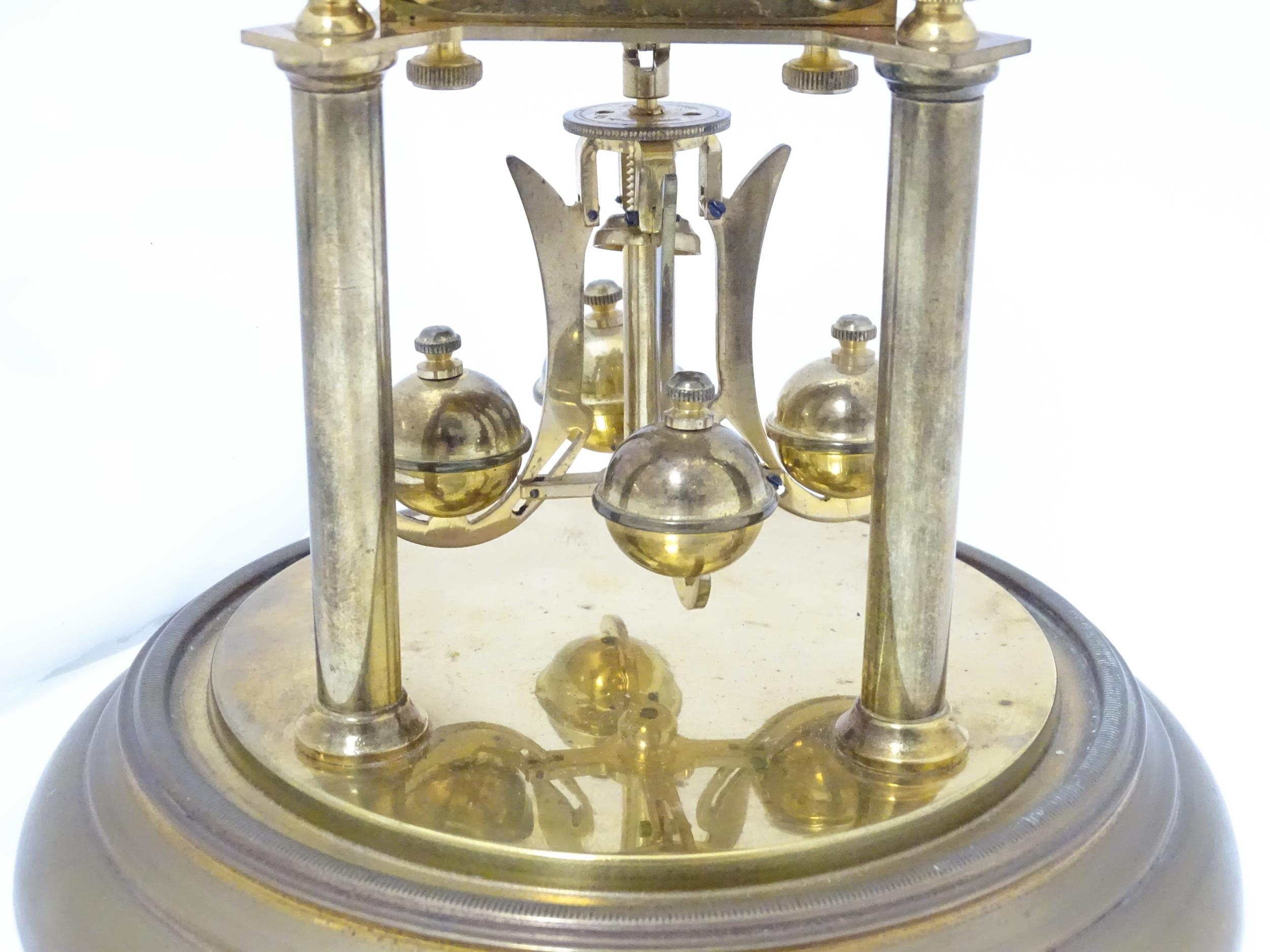 A 20thC anniversary / table clock with white enamel dial and Roman numerals. Under glass dome - Image 6 of 12