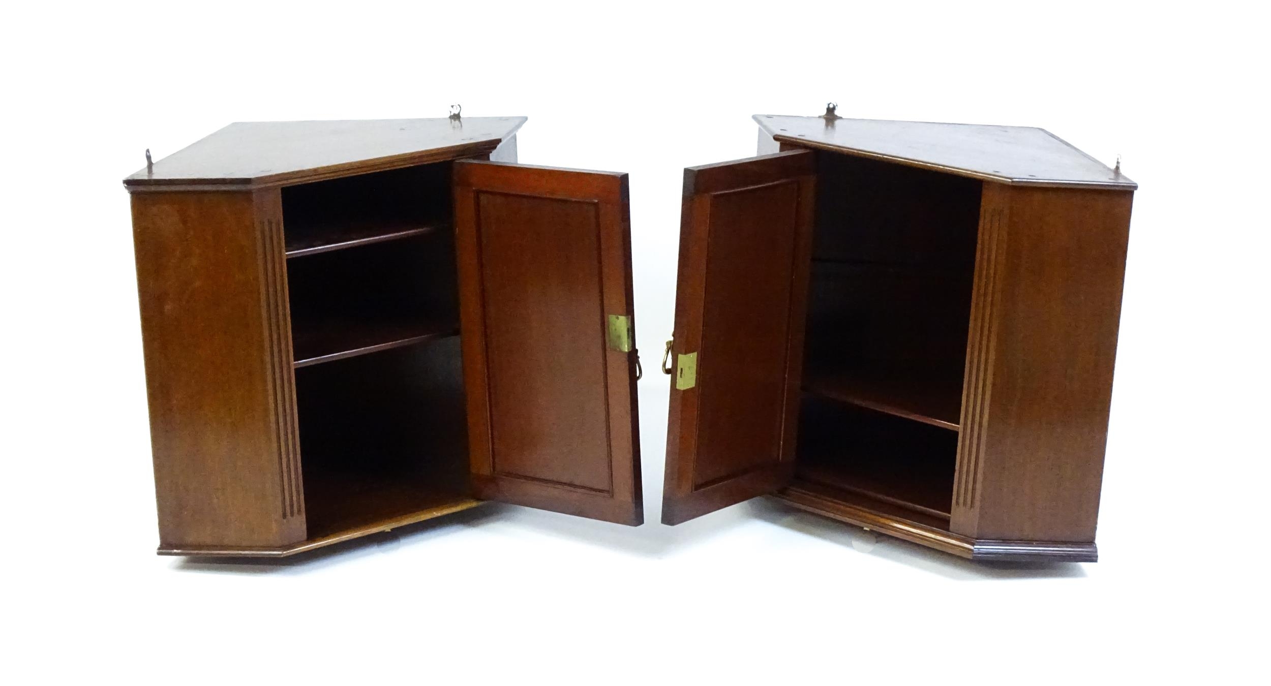 A pair of mid 20thC walnut corner cabinets. Bearing labels to back panels. 21 1/2 high x 26" wide - Image 6 of 7