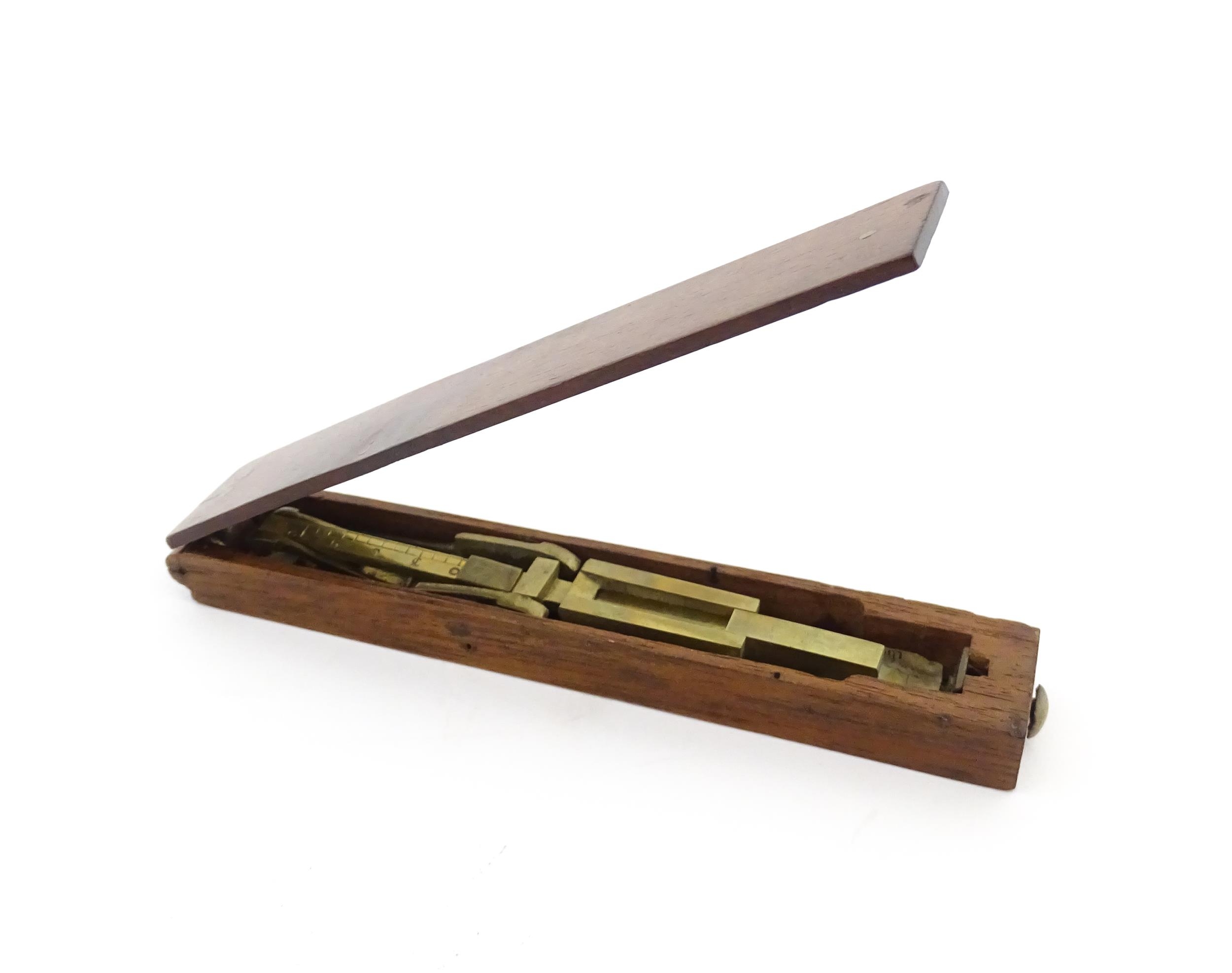 A 19thC mahogany cased brass folding guinea / coin scale. Case approx. 5 1/2" long Please Note - - Image 2 of 11