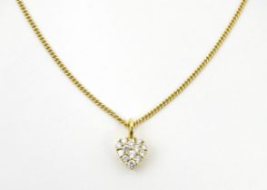 An 18ct gold necklace with heart shaped pendant set with a profusion of diamonds. Approx. 16" long