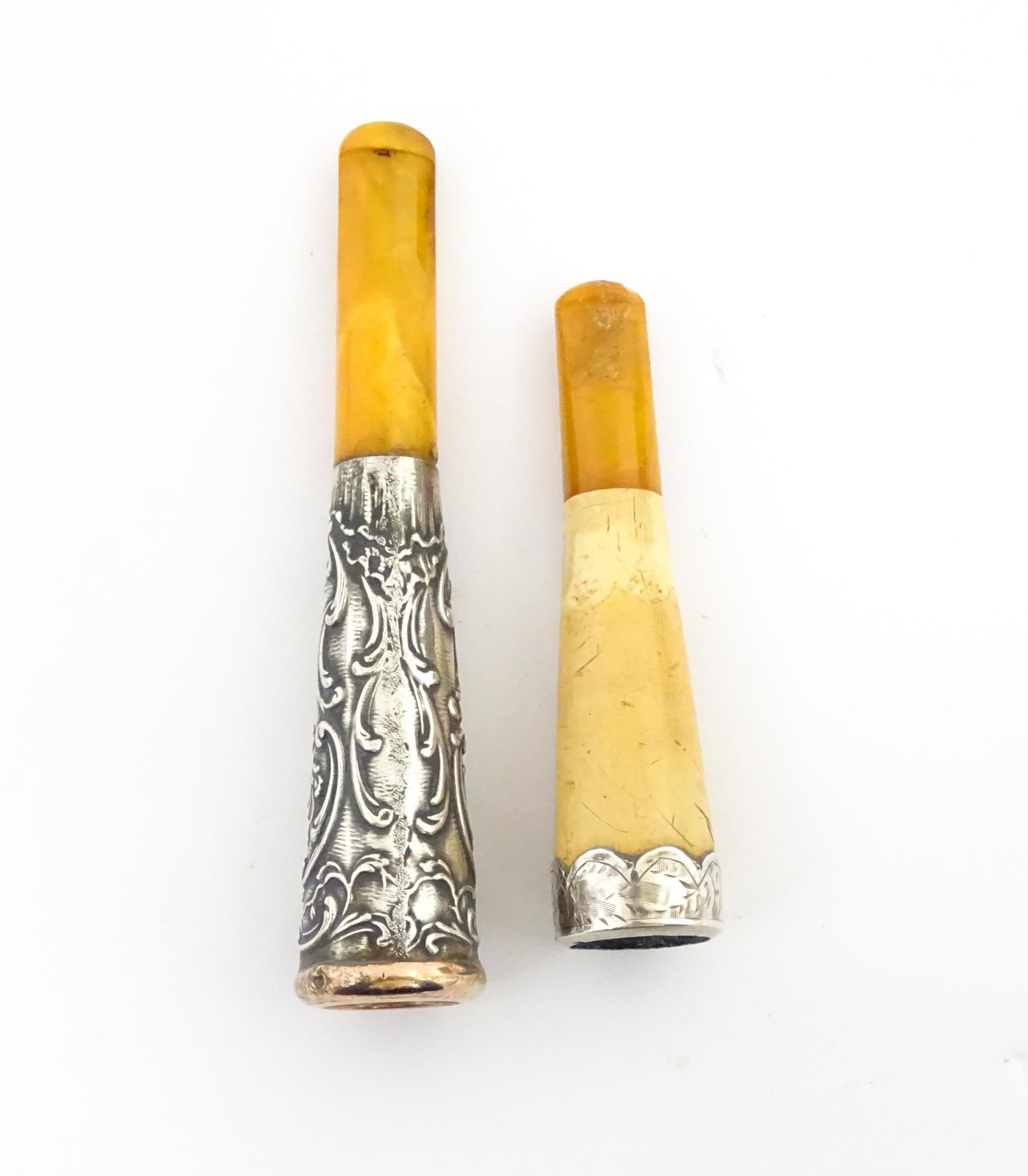 Two amber cheroot mouthpiece holders with white metal mounts, one with meerschaum detail. On - Image 7 of 8