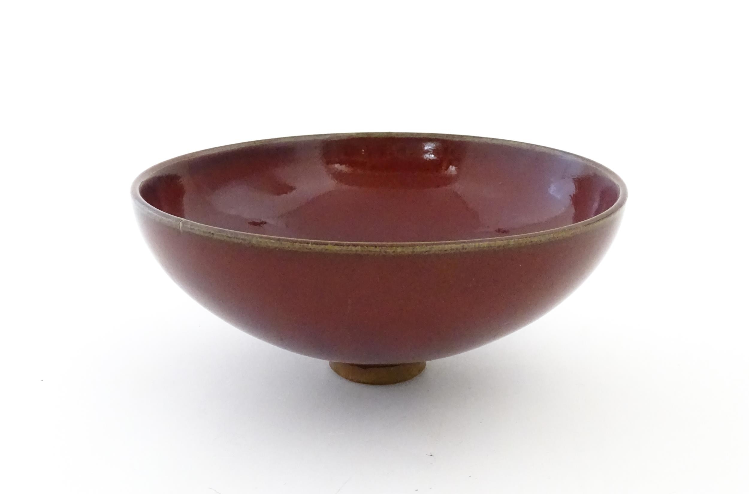 A Chinese sang de boeuf footed bowl. Approx. 2 3/4" high x 6 1/2" diameter Please Note - we do not