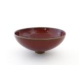 A Chinese sang de boeuf footed bowl. Approx. 2 3/4" high x 6 1/2" diameter Please Note - we do not