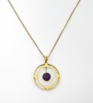 A 9ct gold pendant and chain, the pendant set with central amethyst. Approx 21" long overall. Please