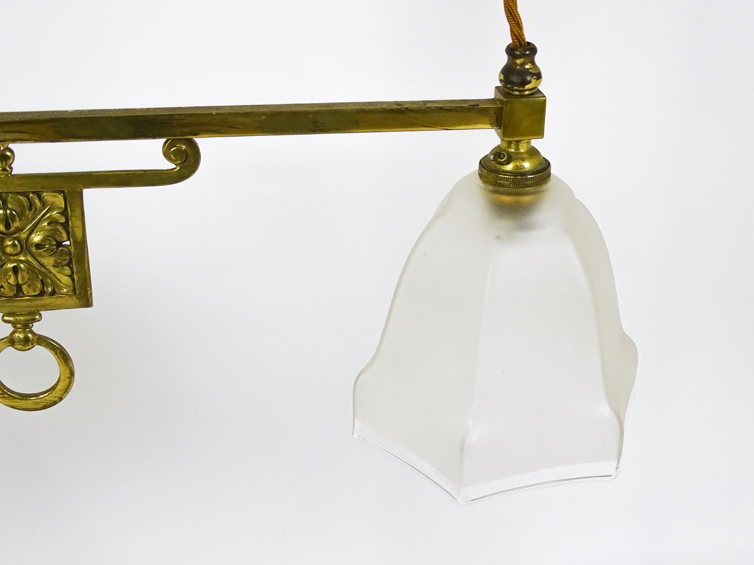 An early 20thC rise and fall adjustable height pendant light with with brass detail and twin frosted - Image 7 of 10