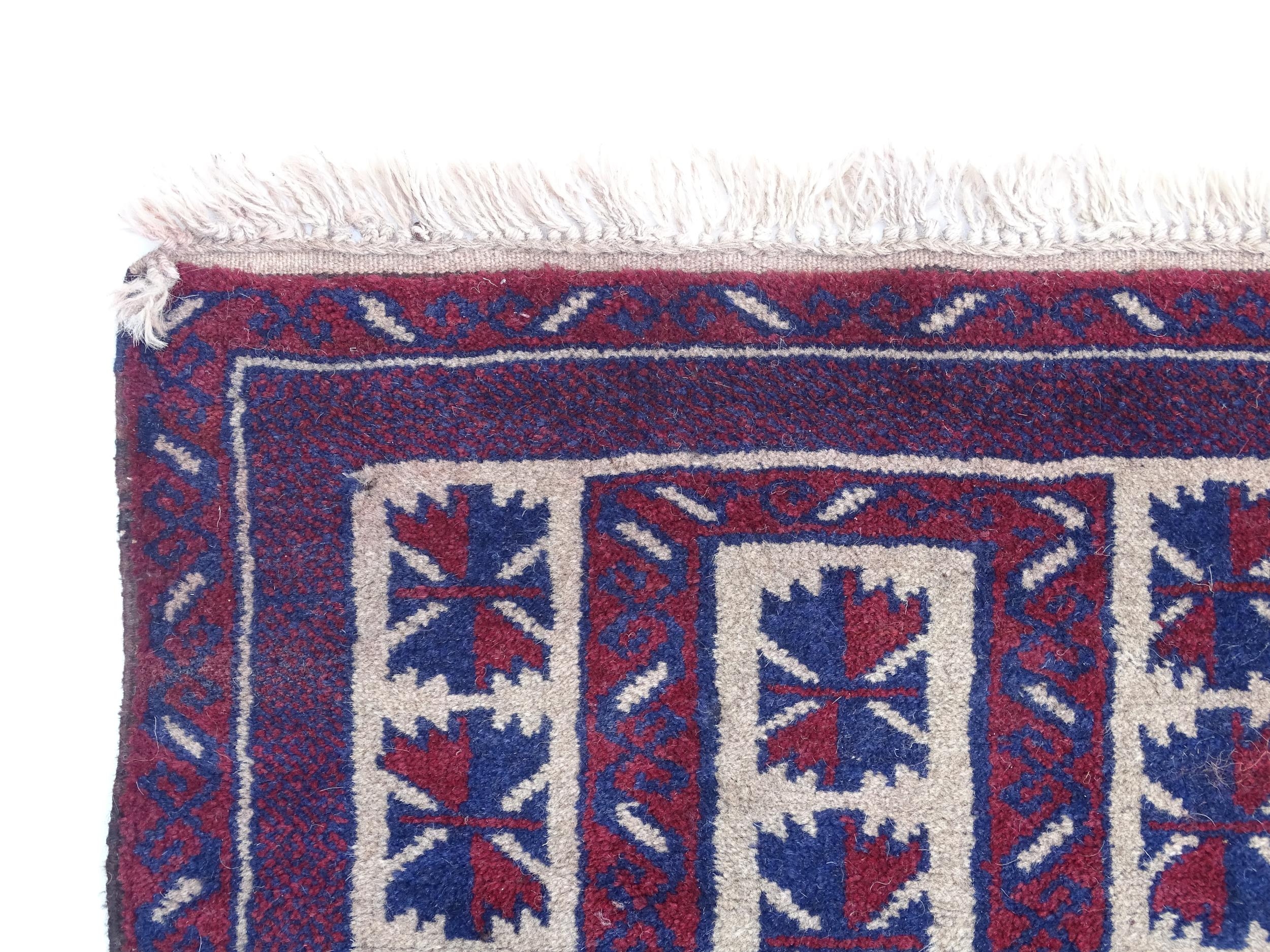 Carpet / Rug : A red, blue and cream ground rug with repeating geometric motifs. Approx. 55" x 29" - Image 3 of 7