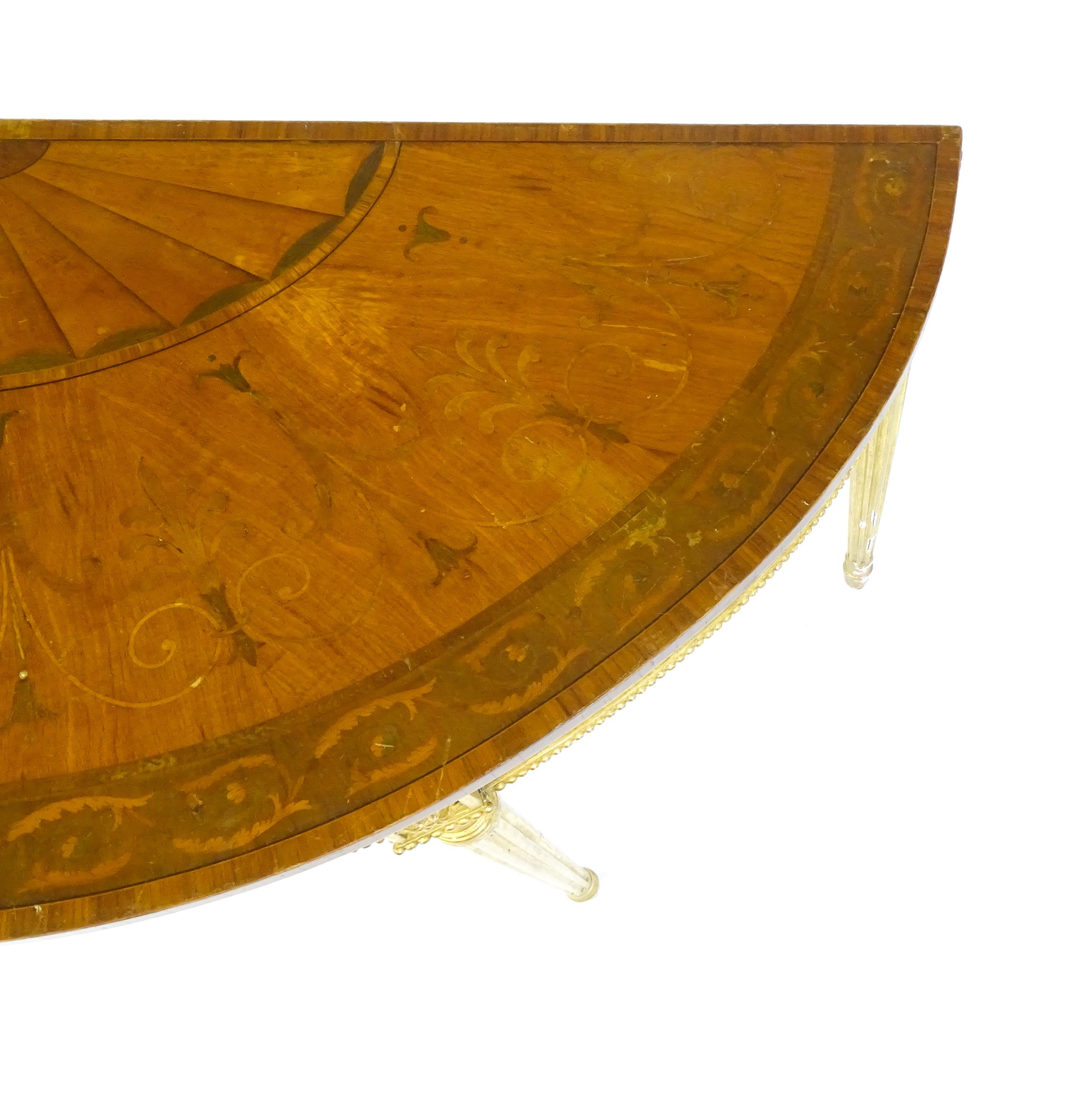 A demi lune console table with a marquetry inlaid top above a fluted frieze and moulded floral - Image 5 of 11